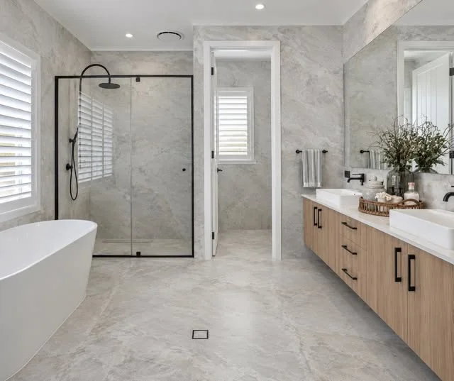 Bathroom with stone look floor and wall tiles