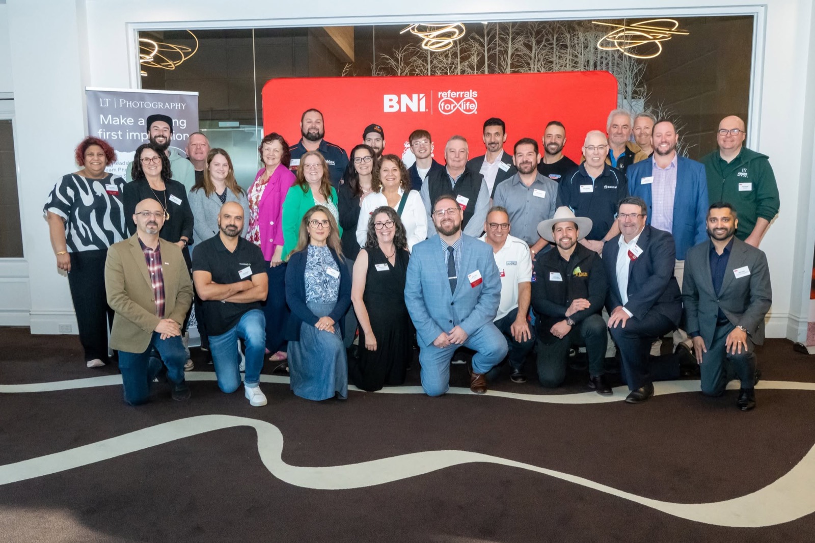 The full BNI Melbourne chapter group photo, including Eden Building & Landscaping