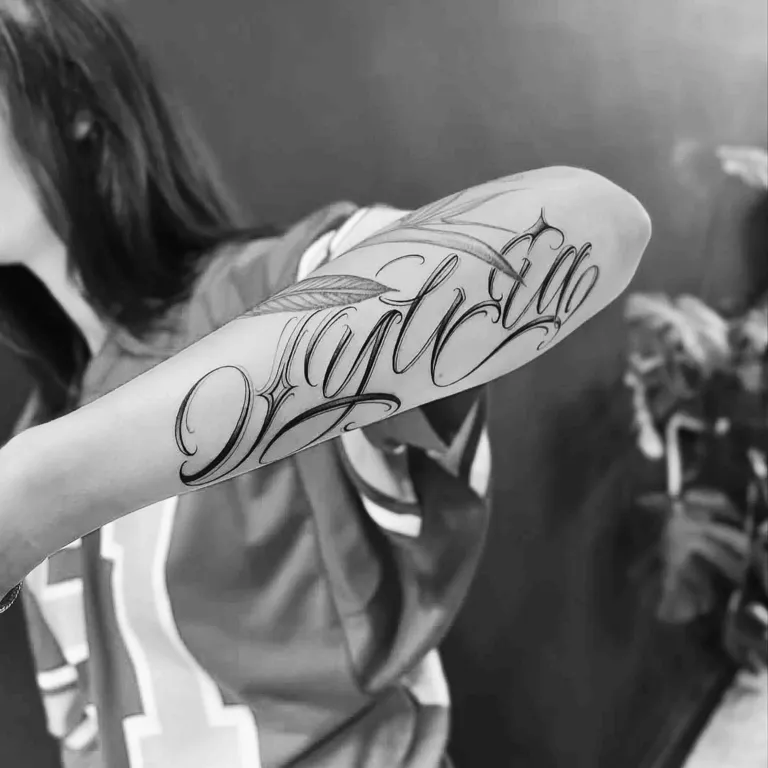 Fine script tattoo
