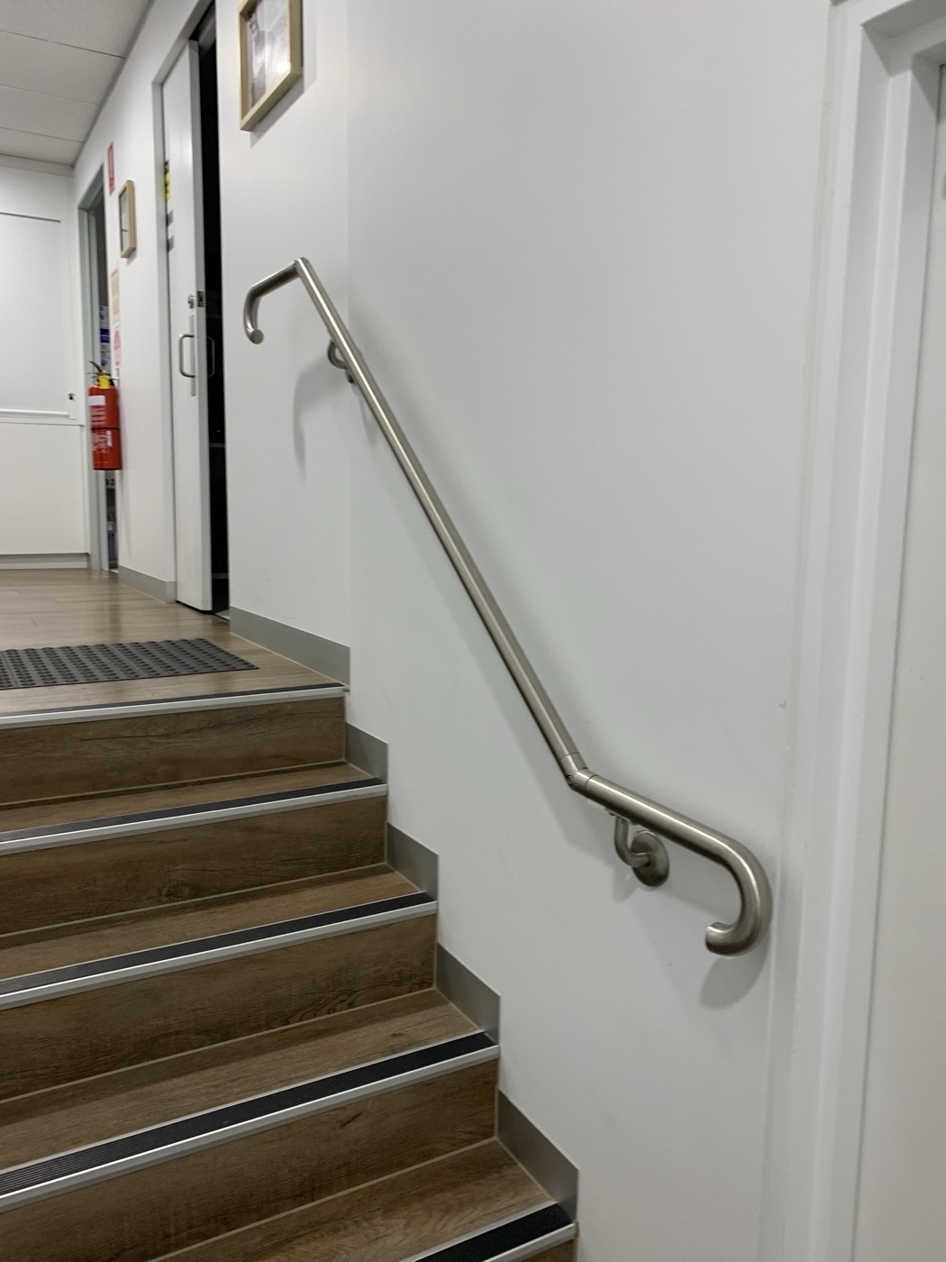 Stainless steel stair handrail installed by JT Handyman in South Yarra VIC