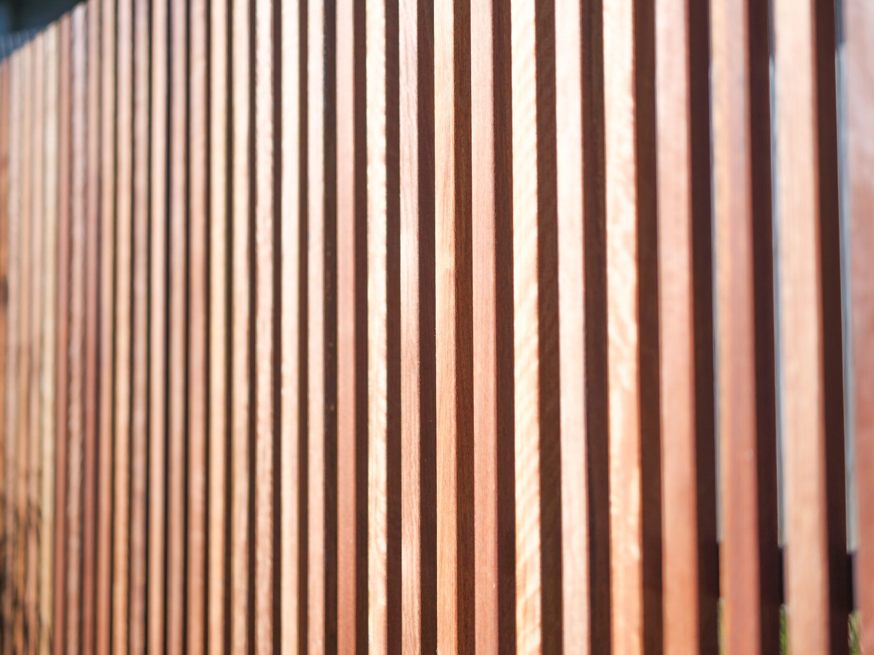 Close view of hardwood slat fence timber grain