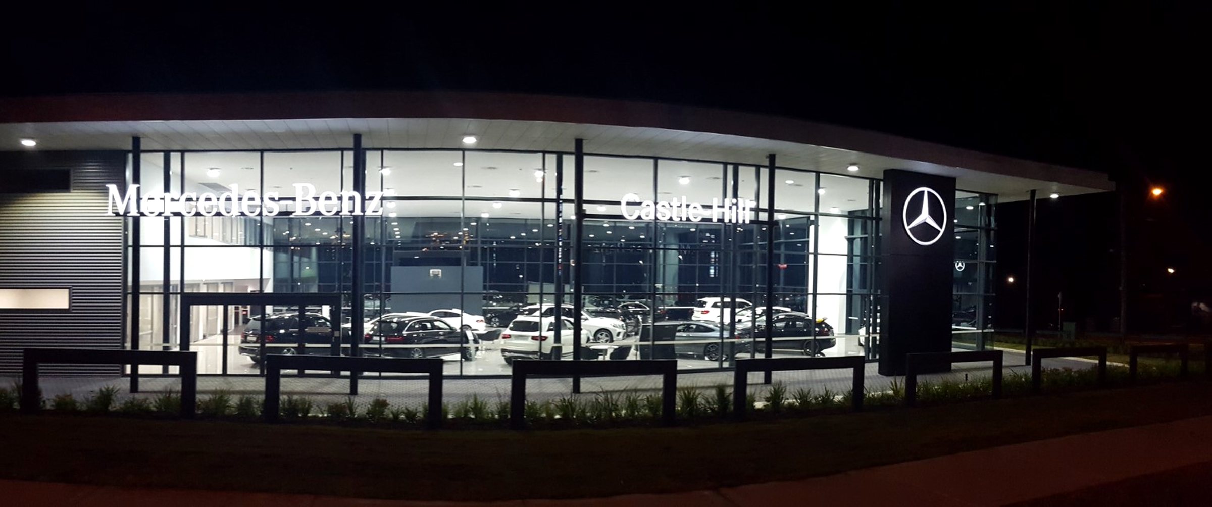 Mercedes-Benz Castle Hill illuminated at night