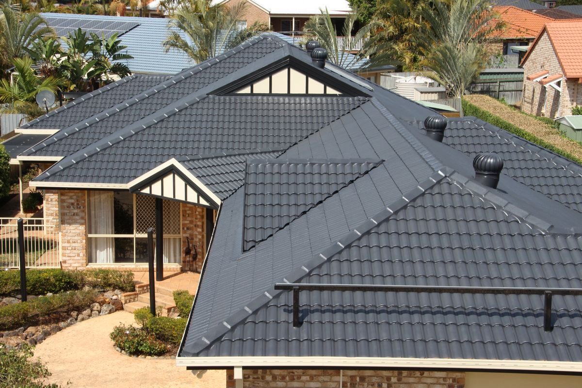 A large finished charcoal tile roof
