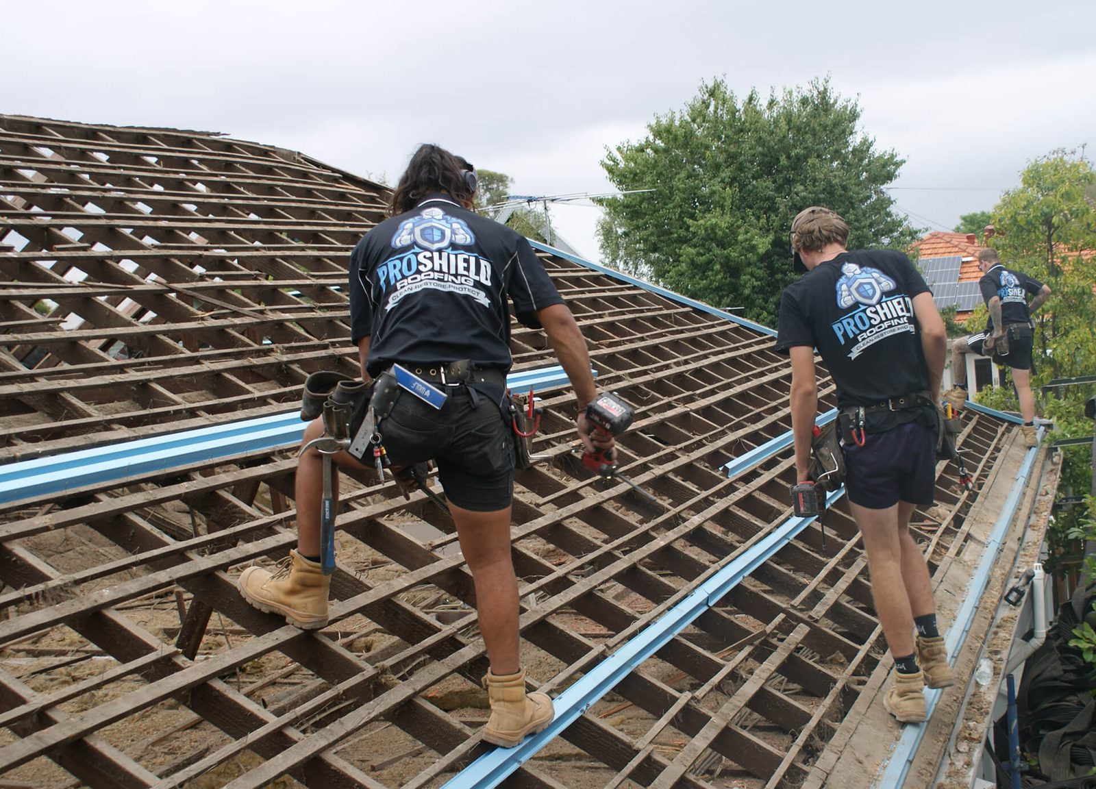 The Pro Shield Roofing crew working across a stripped Melbourne roof