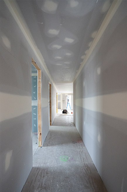 A corridor with new downlights installed