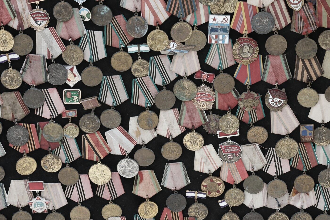 Wall of service medals, archivally mounted, framed by Studio9Art