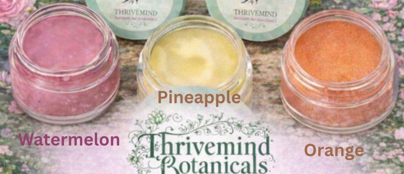 Five Thrivemind Botanicals lip balm jars in peppermint, strawberry, watermelon, pineapple and orange