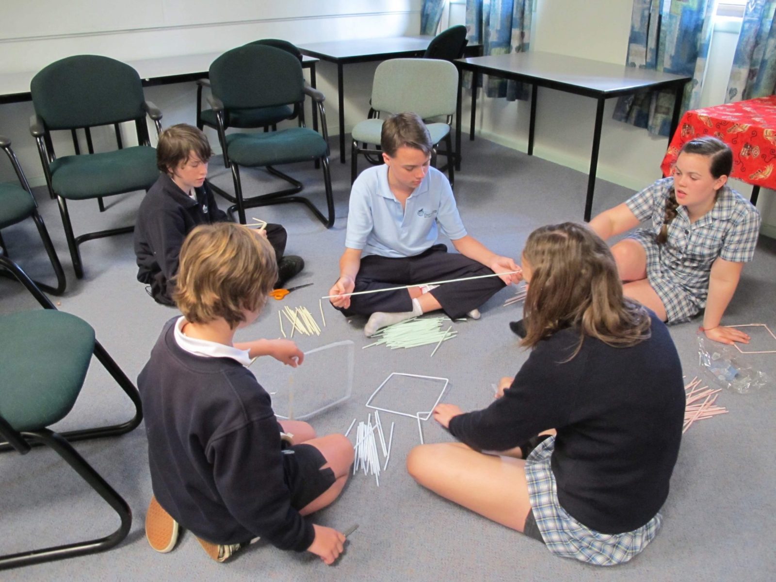 Students sitting in a circle during an Unfurl leadership session