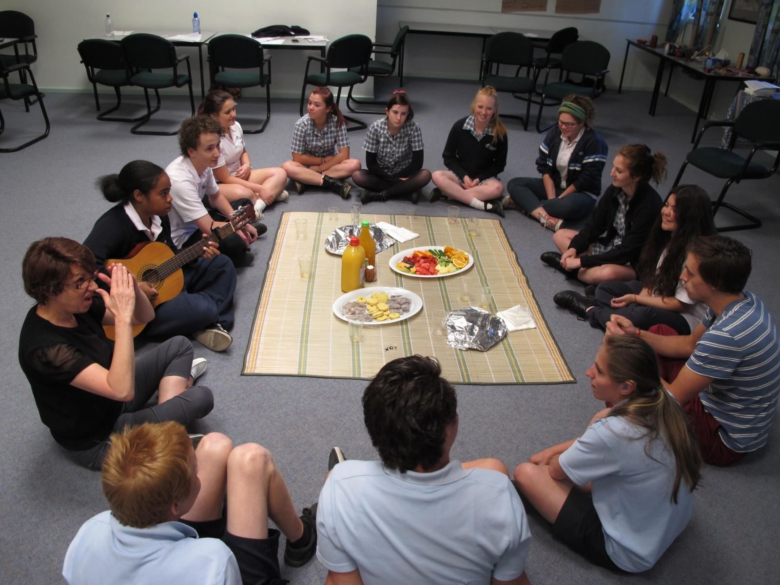 A leadership circle sharing a meal together during a program